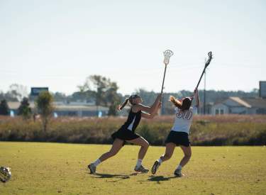 Women Playing Lacrosse