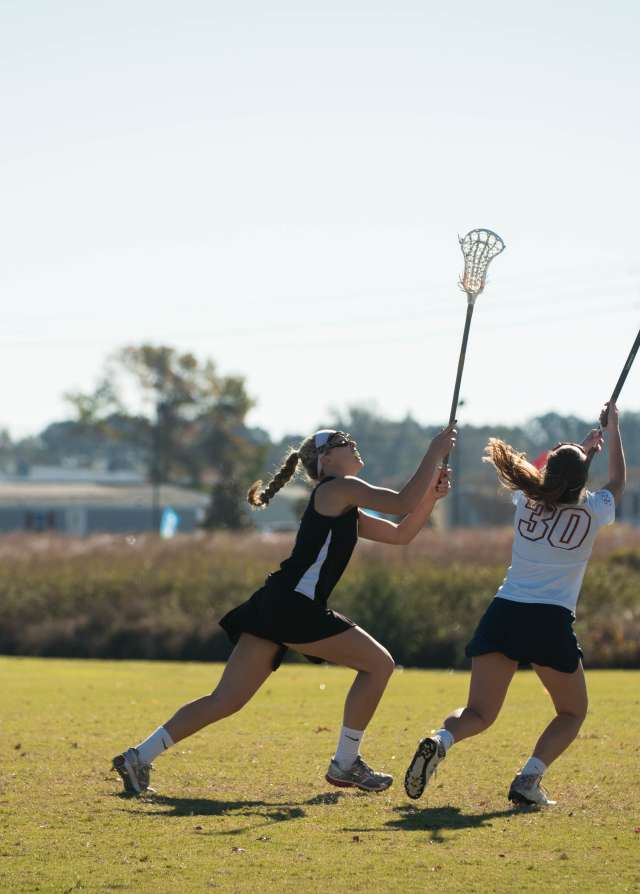 Women Playing Lacrosse