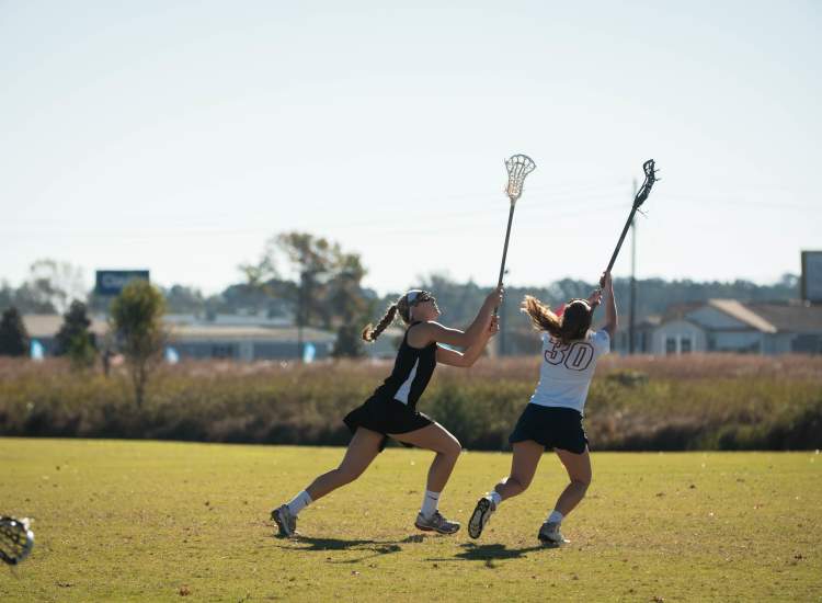 Women Playing Lacrosse